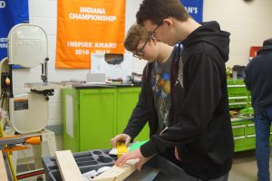 cad subteam members discussing wood