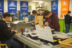 tech subteam members working with power tools