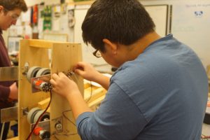 electrical subteam member working on a motor
